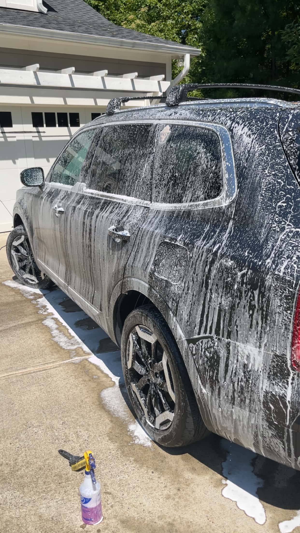 SUV covered in soapy wash